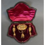 A Victorian Gold Suite of Jewellery to include an oval brooch set with seed pearls with tassel