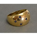 An 18ct. Gold Sapphire Ring set with seven small sapphires