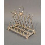 A Silver Plated Six Division Toast Rack in the form of Golf Clubs and Balls
