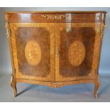 A French Burr Walnut Marquetry Inlaid and Gilt Metal Mounted Side Cabinet of serpentine form with