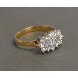 An 18ct. Yellow and White Gold Cluster Ring, approximately 1 ct