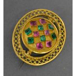 A Brooch of Oval Pierced Form set with pink and green stones