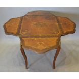 A French Kingwood Parquetry Inlaid and Gilt Metal Mounted Centre Table with four drop flaps raised