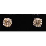 A Pair of 18ct. White Gold Diamond Solitaire Ear Studs, approximately 2.35 ct total weight