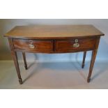 A 19th Century Mahogany Bow Fronted Serving Table, the chequer inlaid top above two frieze drawers