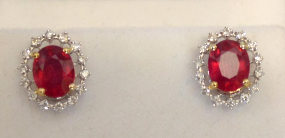 A Pair of 18ct. White Gold Treated Ruby and Diamond Cluster Earrings, rubies approximately 4.65