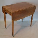 A 19th Century Mahogany Pembroke Table with an end drawer opposed by dummy drawer, raised upon