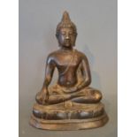 A Chinese Patinated Bronze Model in the form of Buddha, 20 cms tall