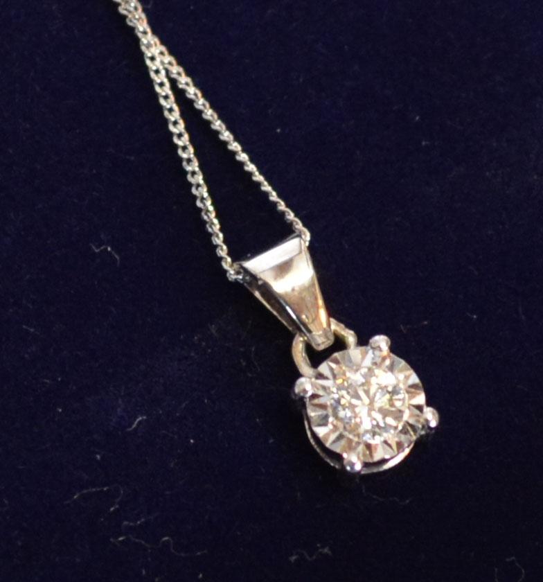 An 18ct. White Gold Diamond Solitaire Pendant, approximately 0.19 ct. together with a 9ct. white