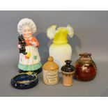 A Carlton Ware Lighter, together with a similar Carlton Ware ashtray, a Royal Doulton figure of