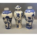 A 19th century Chinese porcelain oviform vase decorated underglaze blue together with two similar