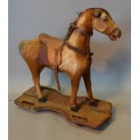 An Edwardian Pull Along Toy in the form of a Horse, 67 cms tall