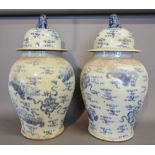 A Pair of Chinese Underglaze Blue Decorated Large Covered Floor Vases, each with Dog of Fo surmount,