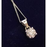 An 18ct. White Gold Diamond Solitaire Pendant, approximately 0.19 ct. together with a 9ct. white