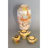 A Japanese Satsuma Baluster Form Vase decorated with figures beside a Lake and highlighted in