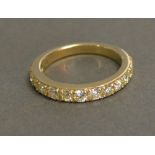 A 9ct. Yellow Gold Half Eternity Ring, approximately 0.95 ct
