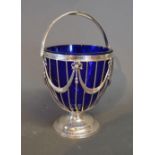 A Chester Silver Basket decorated Bows and Swags with Swing Handle and Blue Glass Liner