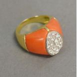 A 15ct. Yellow Gold Coral and Diamond Cocktail Ring, set with diamonds within an oval setting