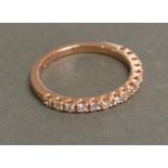 A 9ct. Rose Gold Half Eternity Diamond Ring, approximately 0.35 ct