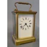 A French Brass Cased Carriage Clock, the enamel dial with Roman numerals and with lever escapement