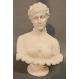 A Reconstituted Marble Bust of a Girl upon circular plinth, 31 cms tall