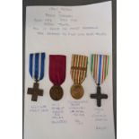 A Group of Four Italian War Medals, WWI and WWII, to include the Merit Cross, Medal of Honour for