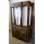A French Kingwood Marquetry Inlaid and Gilt Metal Mounted Display Cabinet with a central glazed door