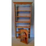 A Pine Narrow Bookcase, the moulded cornice above five shelves, together with a small pine hanging