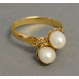 An 18ct. Yellow Gold Double Pearl Crossover Ring