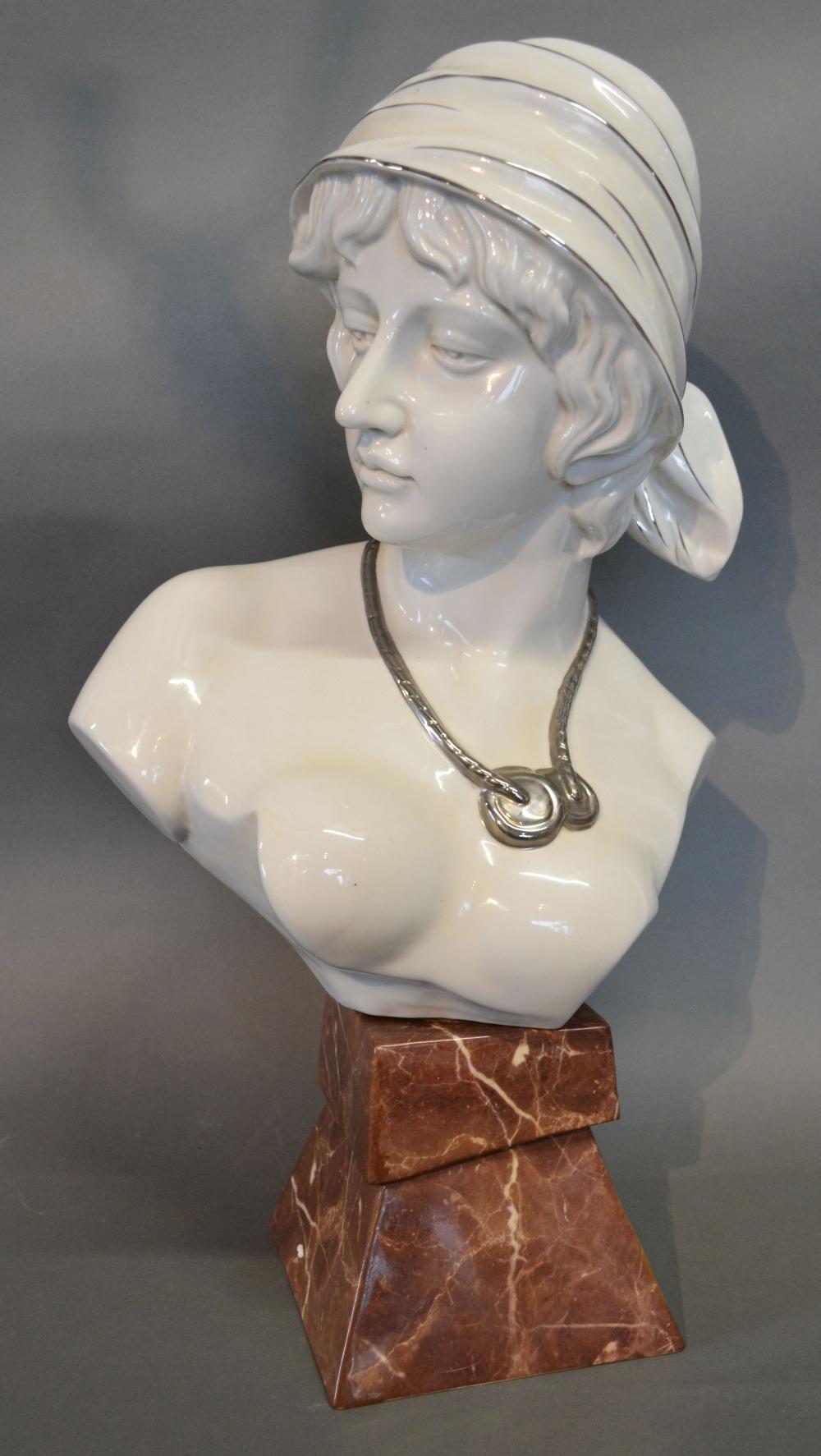 An Art Nouveau Style Porcelain Large Bust in the form of a Girl wearing a Hat, 55 cms tall