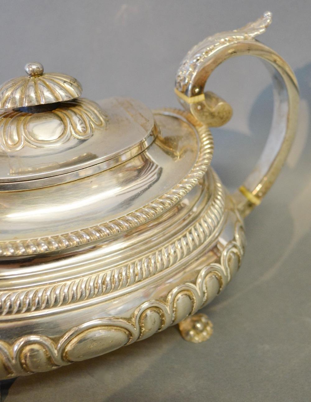 A George III Silver Teapot of Half Lobed Form with shaped handle and four paw feet, Exeter 1818, - Image 2 of 4