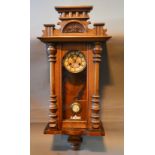 A Mahogany Vienna Type Wall Clock, the enamel dial with Roman numerals and two train movement