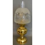 A Brass Oil Lamp with Opaque Glass Shade and Chimney