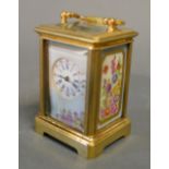 A Miniature French Brass Cased Carriage Clock with Porcelain Panels, the circular enamel dial with