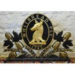 A Whitbread PLC Sign of Pierced Form highlighted with gilt, 92cms wide