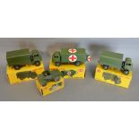 A Dinky Toys No. 623 Army Covered Wagon together with a Dinky Toys No. 673 Scout Car, a Dinky Toys