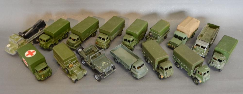 A Dinky Toys Military Ambulance No. 626 together with fourteen other Dinky Toys Military Vehicles