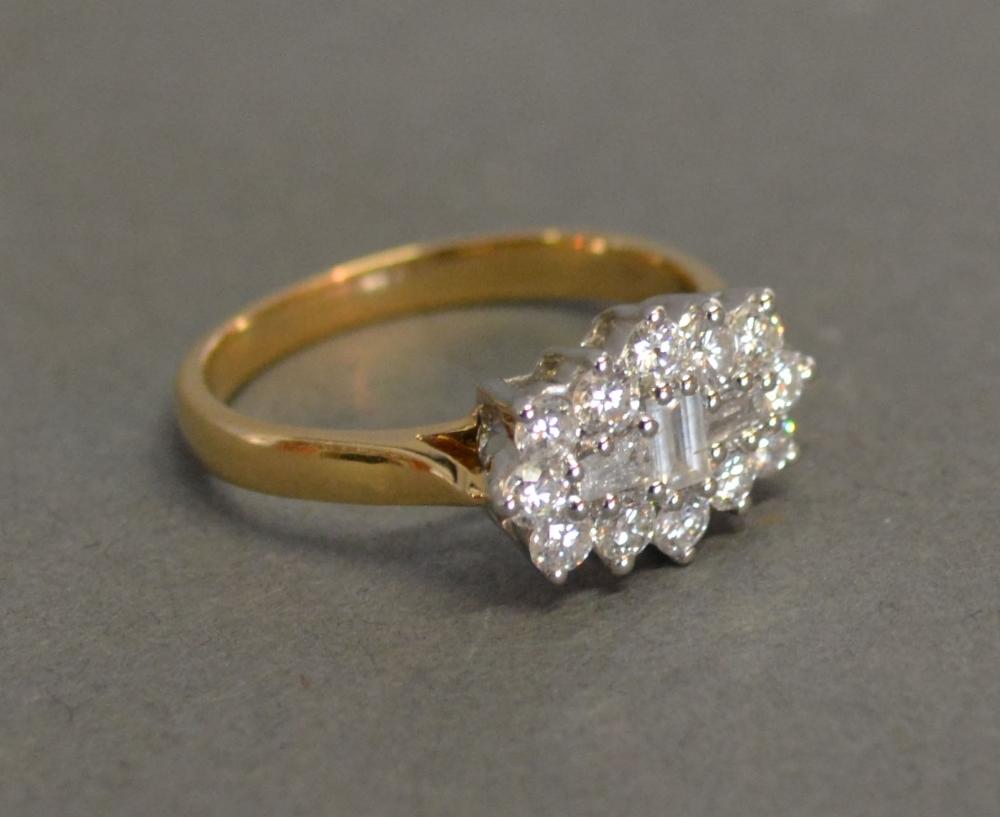 An 18ct. Yellow and White Gold Cluster Ring, approximately 1 ct