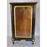 A 19th Century French Ebonised Gilded and Gilt Metal Mounted Display Cabinet, with a variegated