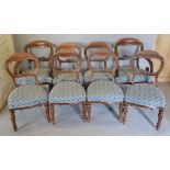 A Set of Eight Victorian Mahogany Dining Chairs comprising arms and six singles all with carved rail