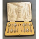 A Set of Six Sheffield Silver Teaspoons with Tongs within fitted lined case by Walker & Hall