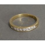 A 9ct. Gold Diamond Band Ring
