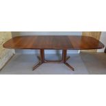 Gudme Mobelfabrik, A Danish Hardwood Extending Dining Table, the crossbanded shaped top above twin