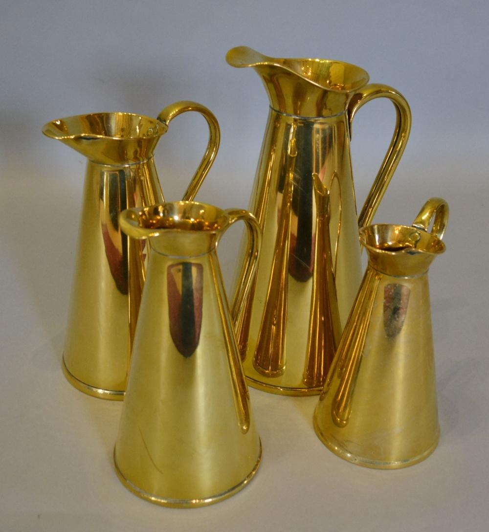 A Set of Four Brass Measures by J.S. & S. ranging from 22 to 34 cms