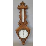 A Victorian Oak Barometer Thermometer, the enamel dial inscribed Benet Fink & Company, London, 97cms