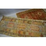 A North West Persian Woollen Runner with an all over design upon a blue, terracotta and cream