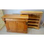 A Victorian Mahogany Chiffonier with a sealed frieze drawer above two arched doors raised upon a