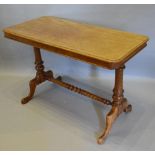 A Victorian Mahogany Centre Table of Rectangular Form with turned legs and stretcher and outswept