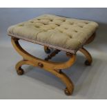 A 19th Century Mahogany Crossover Stool, the button upholstered seat above shaped legs with scroll