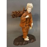A Late 19th Early 20th Century Japanese Carved Ivory and Boxwood Figure in the form of a Girl